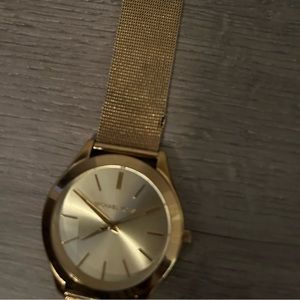 Michael kors gold watch. Watch is adjustable. Watch will also need a battery